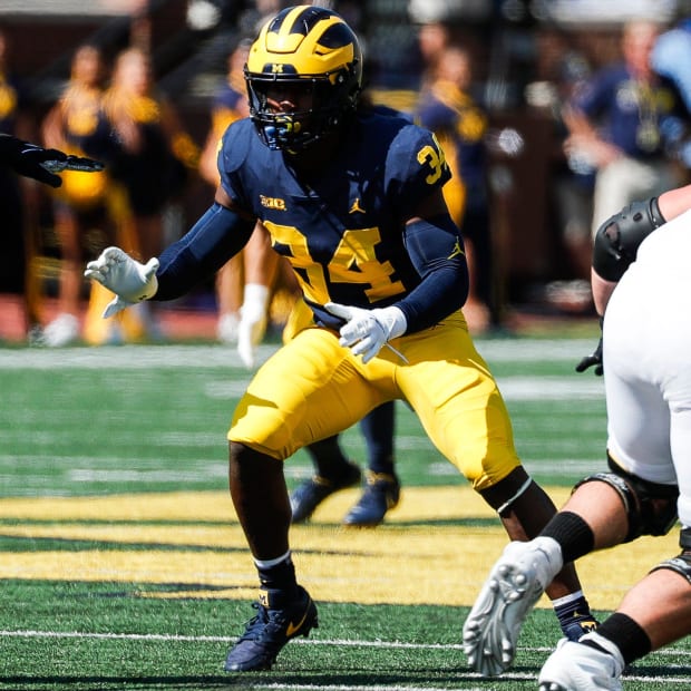 Michigan linebacker Jaydon Hood pursues the ball carrier in a game against Northern Illinois at Michigan Stadium in Ann Arbor