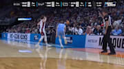 Kevin Harlan deflects the basketball during the first half of a first-round matchup between North Carolina and Ole Miss.