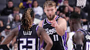 Domantas Sabonis and Keon Ellis chat during a game against the Lakers on Oct. 26.
