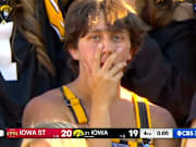 An Iowa fan takes in the Hawkeyes' 20–19 loss to Iowa State on Saturday.