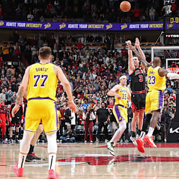 Josh Giddey nails a half-court shot in the Bulls' 119-117 win over the Lakers on March 27.