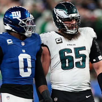 Giants linebacker Brian Burns chats with Eagles right tackle Lane Johnson during the fourth quarter Thursday night at MetLife Stadium.