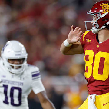 Backup quarterback Sam Huard throws a pass on a fourth-down fake punt against Northwestern.