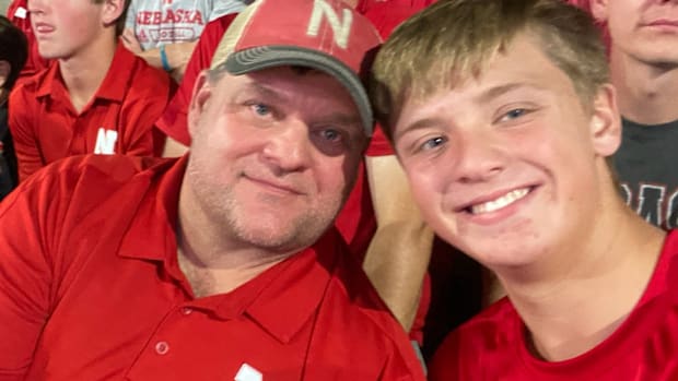 Scott Cyboron (left) and his son at a Nebraska Football contest. 