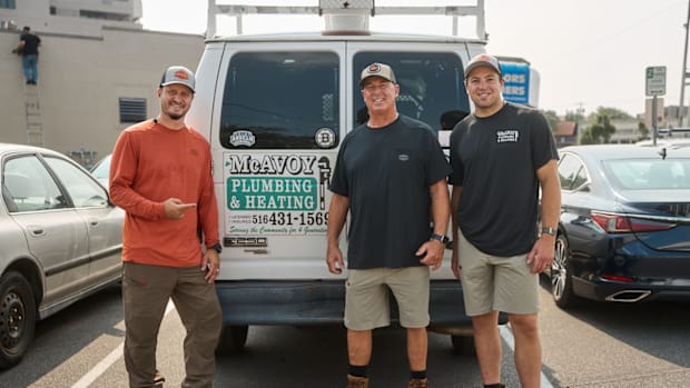 Boston Bruins defenseman Charlie McAvoy (left), his father and fourth-generation master plumber Charles McAvoy, Sr. (center),