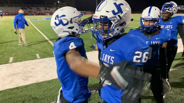 DJ Giddens congratulated after first quarter TD puts Junction City up 28-0 over Emporia.