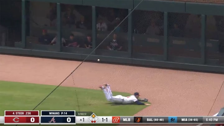 Adam Duvall lays out but misses a diving catch in the first inning of the Braves' series finale against Cincinnati.