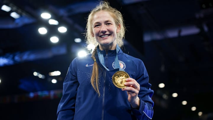 Sarah Hildebrandt stands with her gold medal after winning the 50-kilogram weight class in freestyle wrestling.