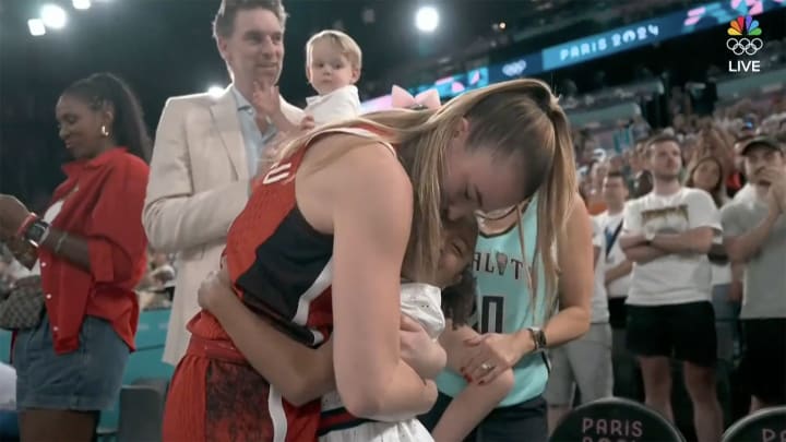 Sabrina Ionescu celebrates winning a gold medal with the Bryant family in Paris.