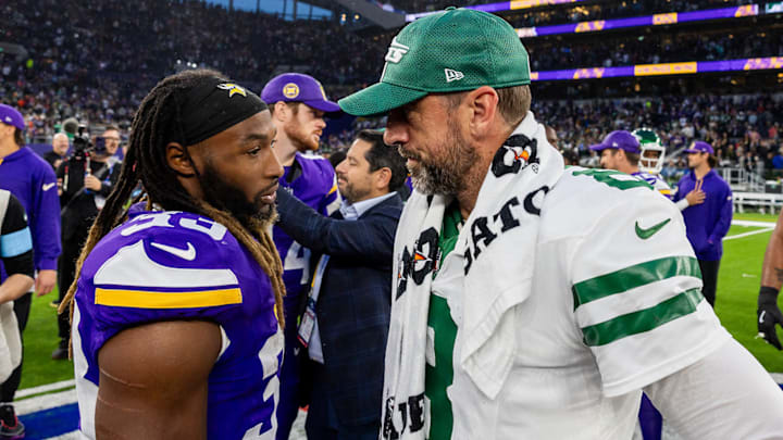 Jets quarterback Aaron Rodgers chats with former teammate Aaron Jones following the Vikings' win in London on Oct. 6. Jets quarterback Aaron Rodgers chats with former teammate Aaron Jones following the Vikings' win in London on Oct. 6.