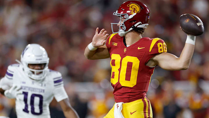 Backup quarterback Sam Huard throws a pass on a fourth-down fake punt against Northwestern.