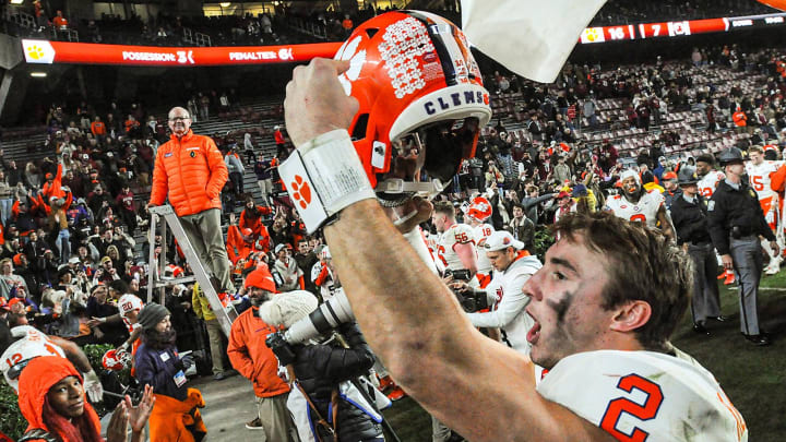 Nov 25, 2023; Columbia, South Carolina, USA; Clemson Tigers quarterback Cade Klubnik (2) points to the Tiger Paw on his helmet after defeating the South Carolina Gamecocks at Williams-Brice Stadium.  Clemson won 16-7. 