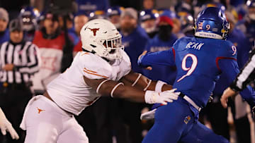 Texas Longhorns defensive end Justice Finkley (1) pressures Kansas Jayhawks quarterback Jason Bean (9)  during the Texas Longhorns football game against the Kansas Jayhawks in Lawrence, Kansas on Saturday, Nov. 19, 2022.

Ut Ku Football Mlc 01255