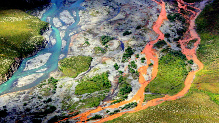 An aerial view of the rust-colored Kutuk River in Gates of the Arctic National Park in Alaska. Thawing permafrost is exposing minerals to weathering, increasing the acidity of the water, which releases metals like iron, zinc and copper.