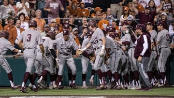 Texas A&M cheers after a grand slam during the game at Disch-Falk Field on Tuesday, March 29,