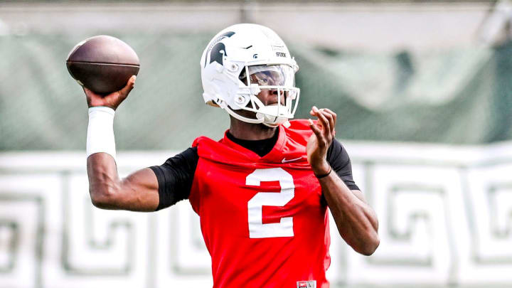 Michigan State quarterback Aidan Chiles throws a pass during the first day of football camp on Tuesday, July 30, 2024, in East Lansing.