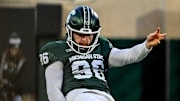 Michigan State's Ryan Eckley punts the ball against Penn State during the second quarter on Saturday, Nov. 15, 2025, at Spartan Stadium in East Lansing.
