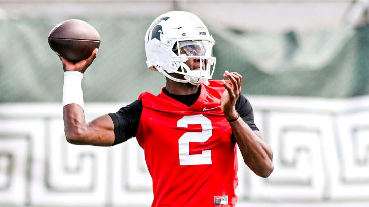 Michigan State quarterback Aidan Chiles throws a pass during the first day of football camp on Tuesday, July 30, 2024, in East Lansing.