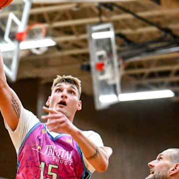 Team Tri-Star and Michigan State's Carson Cooper scores against Team SPS during the Moneyball Pro-Am on Thursday, June 26, 2025, at Holt High School.