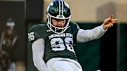 Michigan State's Ryan Eckley punts the ball against Penn State during the second quarter on Saturday, Nov. 15, 2025, at Spartan Stadium in East Lansing.