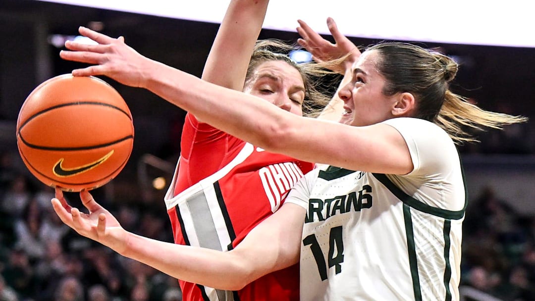 Michigan State's Grace VanSlooten, right, shoots as Ohio State's Elsa Lemmila defends during the second quarter on Sunday, March 1, 2026, at the Breslin Center in East Lansing. Michigan State's Grace VanSlooten, right, shoots as Ohio State's Elsa Lemmila defends during the second quarter on Sunday, March 1, 2026, at the Breslin Center in East Lansing.