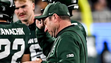 Michigan State's head coach Jonathan Smith approaches the huddle during a timeout in the fourth quarter of the game against Michigan on Saturday, Oct. 25, 2025, at Spartan Stadium in East Lansing.