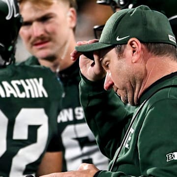 Michigan State's head coach Jonathan Smith approaches the huddle during a timeout in the fourth quarter of the game against Michigan on Saturday, Oct. 25, 2025, at Spartan Stadium in East Lansing.