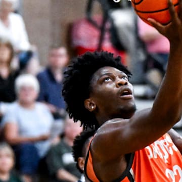 Team Snipes and Michigan State's Trey Fort scores against Team SPS during the Moneyball Pro-Am on Tuesday, July 15, 2025, at Holt High School.