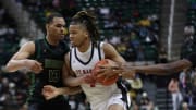 Orchard Lake St. Mary   s Trey McKenney drives the lane against Ann Arbor Huron   s Mohamed Doumbouya during the Michigan High School Athletic Association boys basketball Division 1 semifinal at Breslin Center in East Lansing on Friday, March 15, 2024. OLSM won, 82-42.