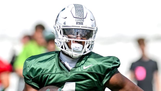 Michigan State's Jaron Glover runs after a catch during the first day of football camp on Tuesday, July 30, 2024, in East Lan