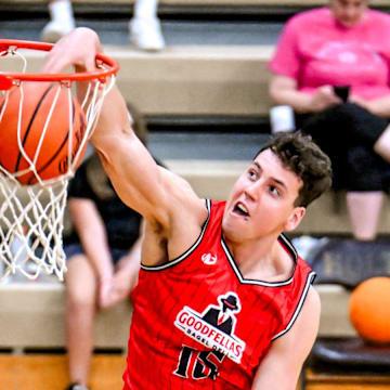 Team Goodfellas' Team Goodfellas' and Michigan State's Szymon Zapala dunks against Team Tri-Star Trust in the game on Tuesday, July 16, 2024, during the Moneyball Pro-Am at Holt High School.