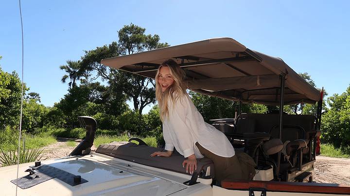 Camille Kostek in a safari vehicle.