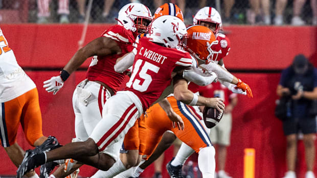  Nebraska defensive back Ceyair Wright sacks Illinois quarterback Luke Altmyer, stripping the ball in the process.