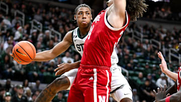 Michigan State's Jeremy Fears Jr., left, passes the ball around Nebraska's Braxton Meah during the first half on Saturday, Dec. 7, 2024, at the Breslin Center in East Lansing.