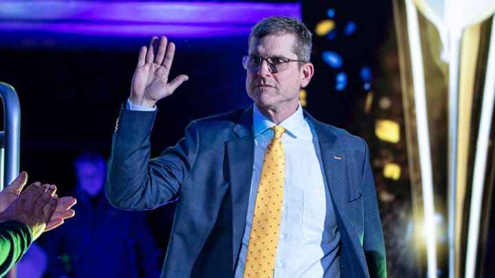 Michigan head coach Jim Harbaugh is introduced during the national championship celebration at