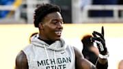 Michigan State's Nick Marsh smiles while warming up before the game against Michigan on Saturday, Oct. 25, 2025, at Spartan Stadium in East Lansing.