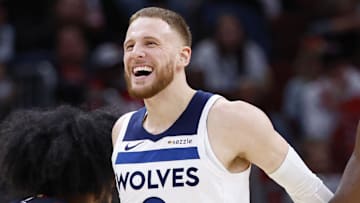Nov 7, 2024; Chicago, Illinois, USA; Minnesota Timberwolves guard Anthony Edwards (5) and guard Donte DiVincenzo (0) react during the second half of a basketball game against the Chicago Bulls at United Center. Mandatory Credit: Kamil Krzaczynski-Imagn Images