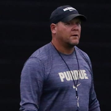 Purdue Boilermakers head coach Barry Odom walks down field 