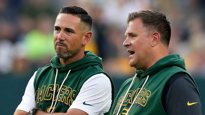 Green Bay Packers Head Coach Matt LaFleur and General Manager Brian Gutekunst talk on the field during Green Bay Packers Family Night on Aug. 2, 2025, at Lambeau Field in Green Bay, Wis.