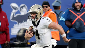 Dec 8, 2024; East Rutherford, New Jersey, USA; New Orleans Saints quarterback Derek Carr (4) runs with the ball against the New York Giants during the fourth quarter at MetLife Stadium. Mandatory Credit: Brad Penner-Imagn Images