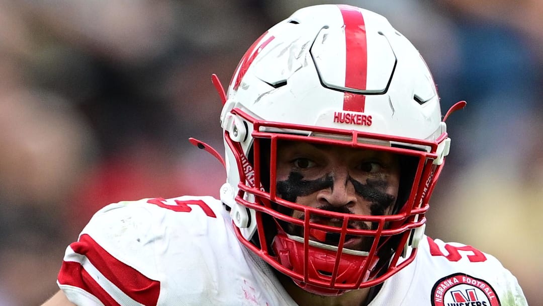 Nebraska Cornhuskers linebacker John Bullock (5) runs the ball for a touchdown after an interception against the Purdue Boilermakers.