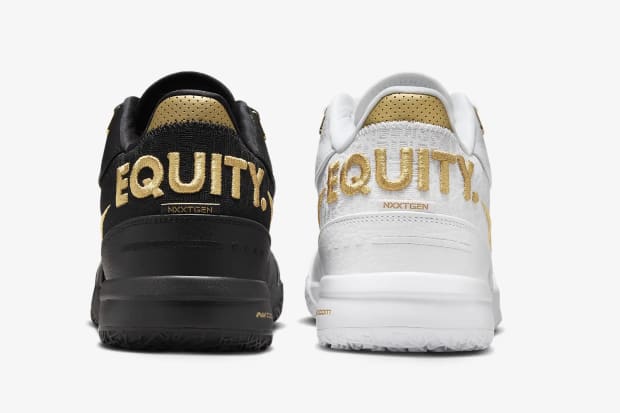 LeBron James' white and black sneakers with the word "EQUITY" on the heels.