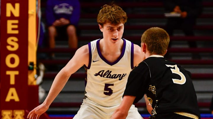 Albany boys basketball junior Braeden Justin plays defense during the 2025 Minnesota state tournament semifinal against Caledonia on March 21, 2025 at Williams Arena in Minneapolis. The Huskies won 59-54.