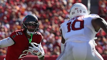 Tampa Bay Buccaneers wide receiver Emeka Egbuka (2) runs against Arizona Cardinals linebacker Josh Sweat (10) 