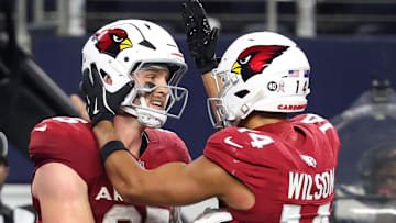 Nov 3, 2025; Arlington, Texas, USA;  Arizona Cardinals tight end Trey McBride (85) celebrates with wide receiver Michael Wilson (14) after scoring a touchdown against the Dallas Cowboys in the second half at AT&T Stadium. Mandatory Credit: Kevin Jairaj-Imagn Images