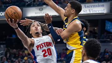 Former Detroit Pistons guard Carsen Edwards (20) shoots the ball while Indiana Pacers guard Tyrese Haliburton (0) defends in the first half at Gainbridge Fieldhouse.