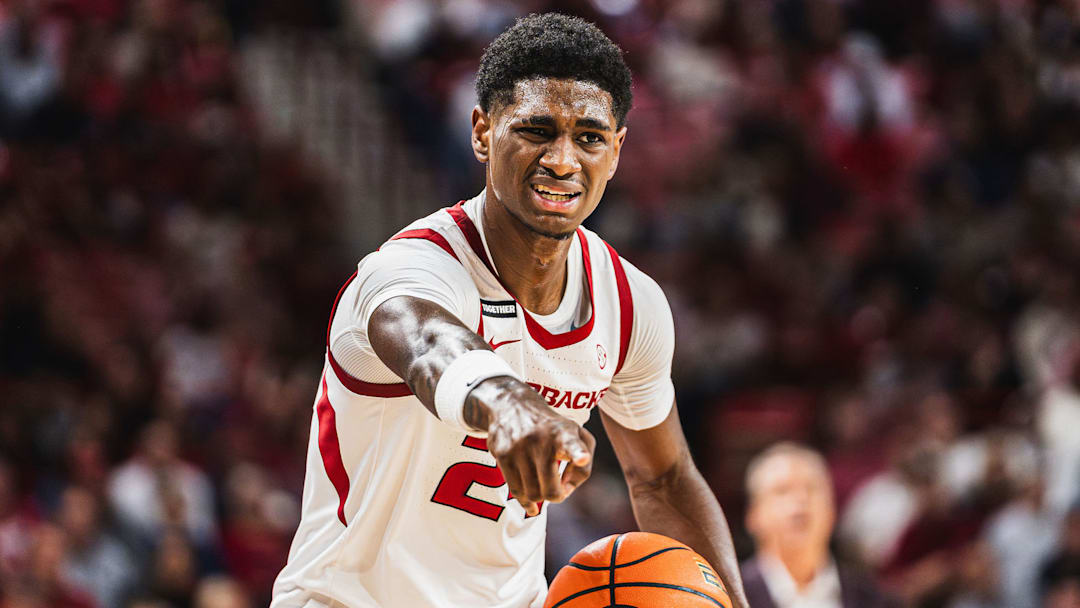 Billy Richmond (24) holds the ball against Lipscomb. The Razorbacks won 76-60. 