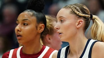 Dec 21, 2024; Hartford, Connecticut, USA; UConn Huskies guard Paige Bueckers (5) and USC Trojans guard JuJu Watkins (12) on the court in the first half at XL Center. Mandatory Credit: David Butler II-Imagn Images