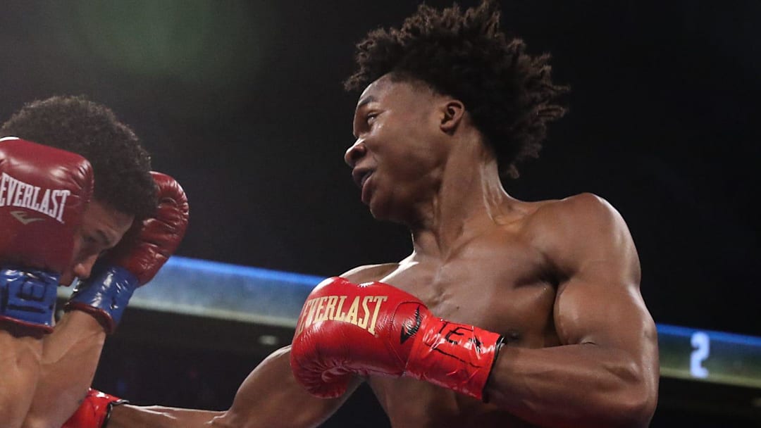 Lightweights Ronal Ron, blue corner, and Abdullah Mason, red corner, fight in a Top Rank bout at the American Bank Center on Saturday, April 13, 2024, in Corpus Christi, Texas. Mason won in four rounds by technical knockout.