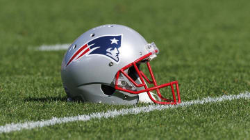 Oct 2, 2022; Green Bay, Wisconsin, USA;  A New England Patriots helmet sits on the field during warmups prior to the game against the Green Bay Packers at Lambeau Field. Mandatory Credit: Jeff Hanisch-USA TODAY Sports